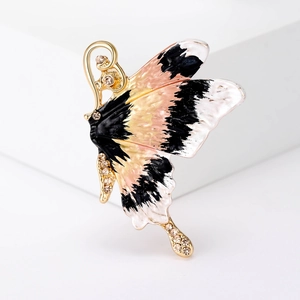 Elegant gold butterfly brooch with colorful enamel wings and crystal rhinestones