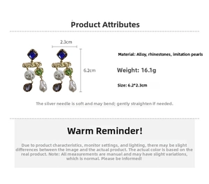 Detailed view of asymmetric earrings with blue rhinestones and dangling imitation pearls