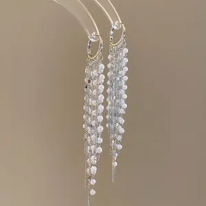 Elegant 18k gold plated long fringe earrings with white pearls on silver metal chains