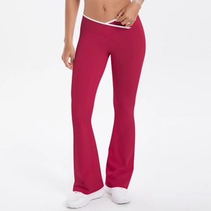 Detail of red flared yoga pants with crossover V-waistband and white contrast trim