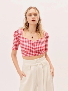 Detail of red and white checkered crop top with square neckline and drawstring front