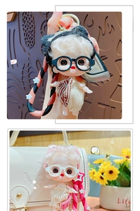 Close-up of cute cartoon doll keychain with movable limbs on white leather bag