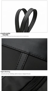 Detail of leather handles, precision double stitching and smooth metal zipper on tote bag