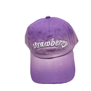 Purple gradient baseball cap with white strawberry embroidery and distressed washed finish