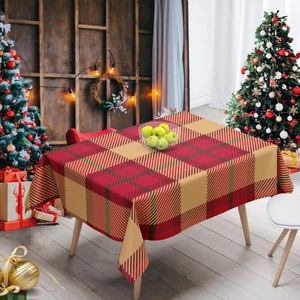 Classic red and gold checkered Christmas tablecloth on a wooden table in a festive room