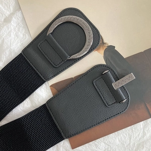 Vintage elastic waist belt with engraved silver buckle and black faux leather for dresses