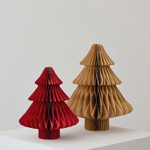 Set of decorative paper honeycomb Christmas trees in red and brown for holiday table decor