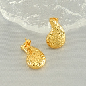 Gold hammered teardrop earrings made of stainless steel with a vintage metallic texture