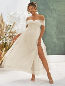 Detail of off-white off-the-shoulder maternity tulle dress with high side slit for formal wear