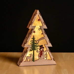 Detail of wooden Christmas tree LED light with snowman reindeer and warm star glow