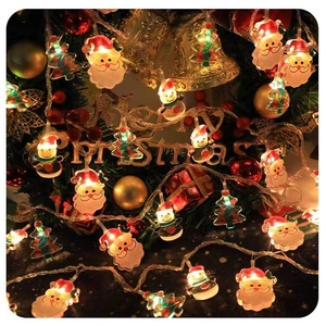 Detail of Christmas LED string lights with Santa Claus and Snowman decorative figures