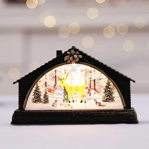 Lighted Christmas water lantern featuring golden deer scene and pinecone accents
