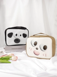 Detail of cute cartoon PU makeup bags with top handles and zippers on silk fabric