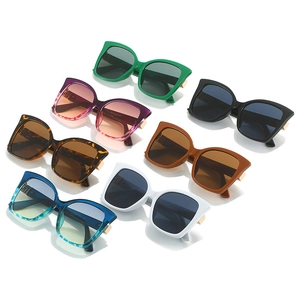 Detailed collection of cat-eye sunglasses featuring vintage oversized frames and gold hinges
