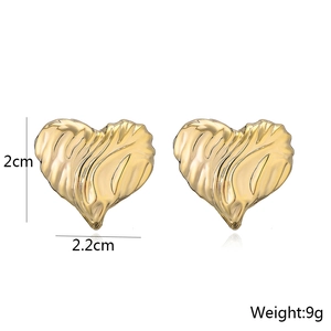 Detail view of gold heart studs showing 2cm height, 2.2cm width and 9g weight