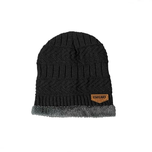 Unisex black knitted beanie with thick grey fleece lining and embossed sports leather patch
