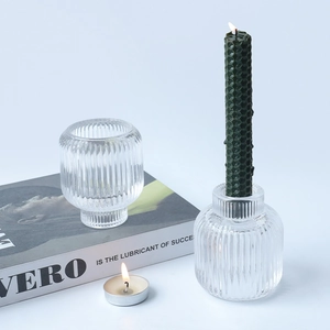 Nordic ribbed glass candle holder with green textured taper candle and tealight