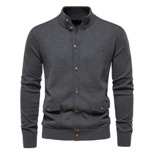 Detail of dark grey knit cardigan featuring a stand collar and high-quality buttons