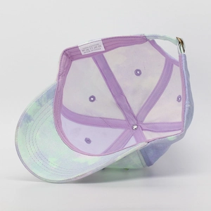 Detail of 100% cotton tie-dye baseball cap interior with purple lining and metal buckle