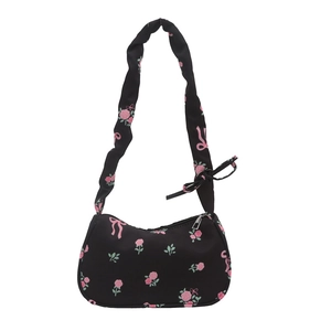 Floral nylon shoulder bag with pink roses and bow details on white background
