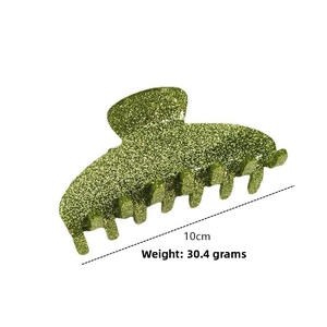 Detail of 10cm green glitter hair claw clip weighing 30.4g with multi-tooth design