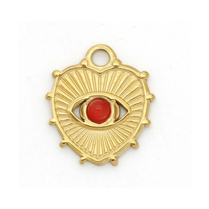 Detail of heart-shaped evil eye pendant with gold plating and red center stone