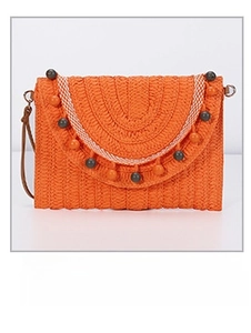 Detail of orange woven straw envelope bag with wood beads and checkered trim