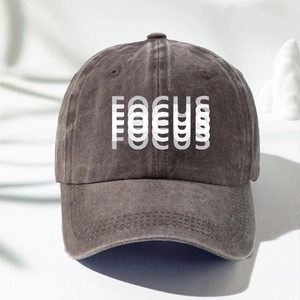 Detail view of washed cotton baseball cap with artistic FOCUS print and vintage texture