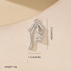 Detailed view of silver stream-lined bow pendant with pear-shaped zircon and dimensions