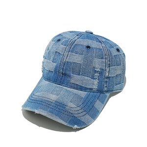 Distressed checkerboard light blue denim baseball cap with vintage woven pattern and fraying