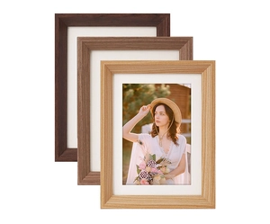 Close-up of assorted retro wooden picture frames showing natural wood grain texture