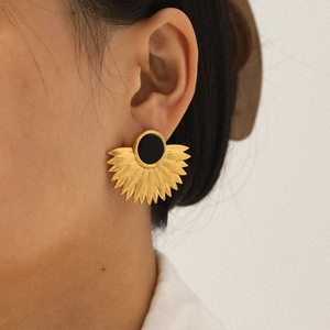 French style 18K gold fan leaf earrings with black round stone inlay on model ear