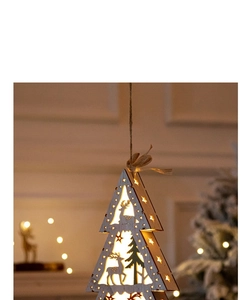 Close-up of a wooden Christmas tree LED ornament with warm glowing light for home decor