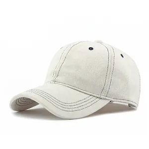 Off-white cotton baseball cap with contrast navy blue stitching and six-panel crown