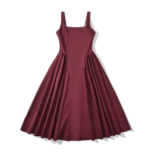 Detail of wine red sleeveless dress showing wide shoulder straps and square neckline
