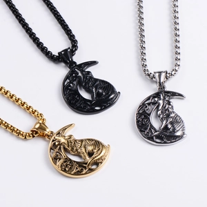 Detailed trio of Viking wolf moon pendants in gold, black, and silver stainless steel