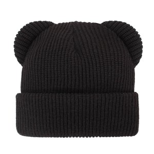 Close-up of black knitted baby hat with bear ears and thick ribbed texture design