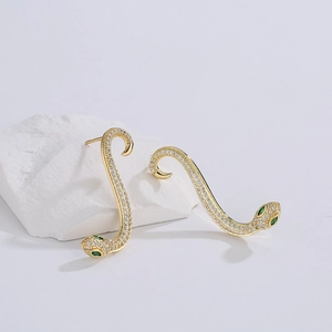 Exaggerated 18K gold plated snake stud earrings with pavé zircons and green stone eyes