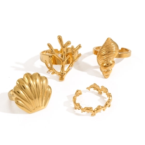 Adjustable gold stainless steel ocean ring set featuring shell, coral and dolphin designs