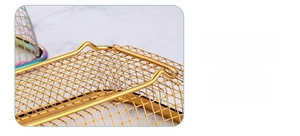 Detail of golden stainless steel basket with elevated feet to prevent water accumulation