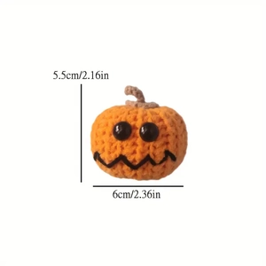 Crocheted orange pumpkin detail with size markings 5.5cm height and 6cm width