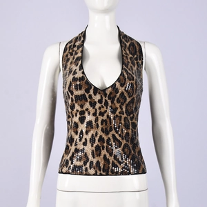 Detail of leopard print sequins on a halter neck crop top with a slim fit design