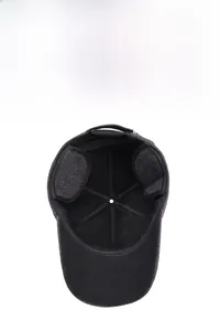 Detailed view of foldable earflaps and warm fleece lining in winter baseball cap