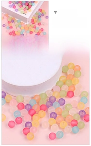 Macro detail of assorted macaron colored matte acrylic beads for DIY jewelry making