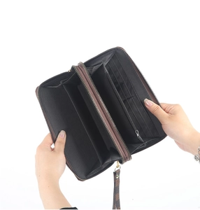 Detailed interior of a large double zipper checkered wallet with multiple card slots