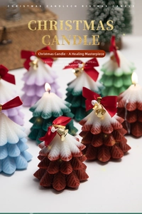 Detailed view of colorful Christmas tree scented candles with bows and golden bells