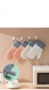 Detail of silicone oven glove with integrated hanging loop for easy kitchen storage