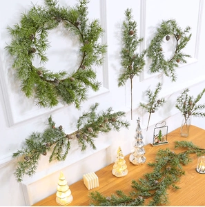 Close-up of realistic pine needle wreath with natural pine cones for festive decoration