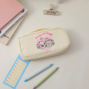 Close-up of cute beige canvas stationery bag with bunny and puppy patterns in INS style