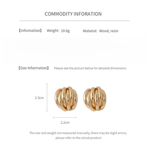 Detail view of golden spiral stud earrings with dimensions and material specifications